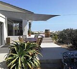 Ferienhaus mit freiem Blick auf das Meer und seine Umgebung am Van Riebeeckstrand